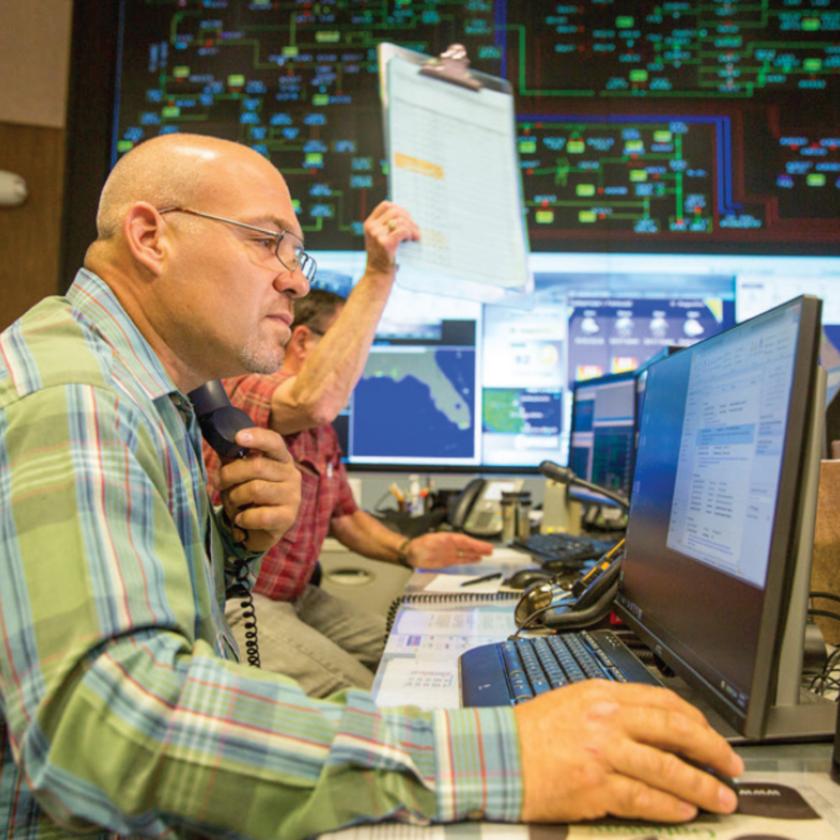 Employee working on outage reporting