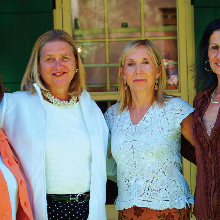 ABOVE: From left, Beverly Duran, Barbara Richardson, Patricia French and Alexis Girard were instrumental in starting the New Mexico Historic Marker Initiative. BACKGROUND: Workers complete installation of the roadside marker honoring Cathay Williams. PHOTOS COURTESY OF THE NEW MEXICO HISTORIC WOMEN MARKER INITIATIVE