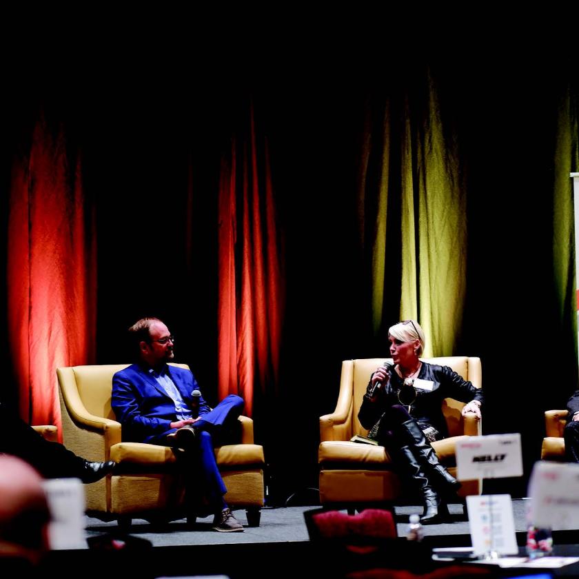 Charise Swanson, speaking at a New Mexico Chamber of commerce event, is the first woman in NMREC history to serve as its CEO.