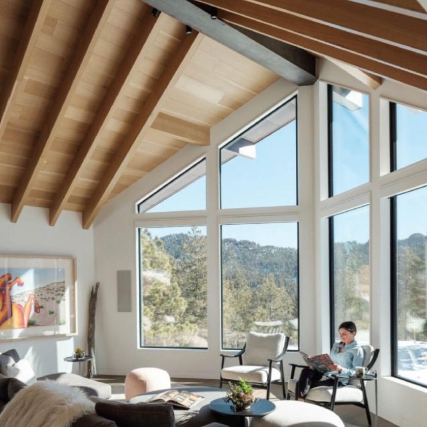 Woman reading in sunroom